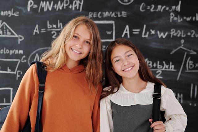 Math Students in front of a black board